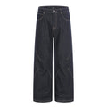 Men's wide-leg raw indigo denim jeans with diagonal orange contrast seam detailing, front and back view