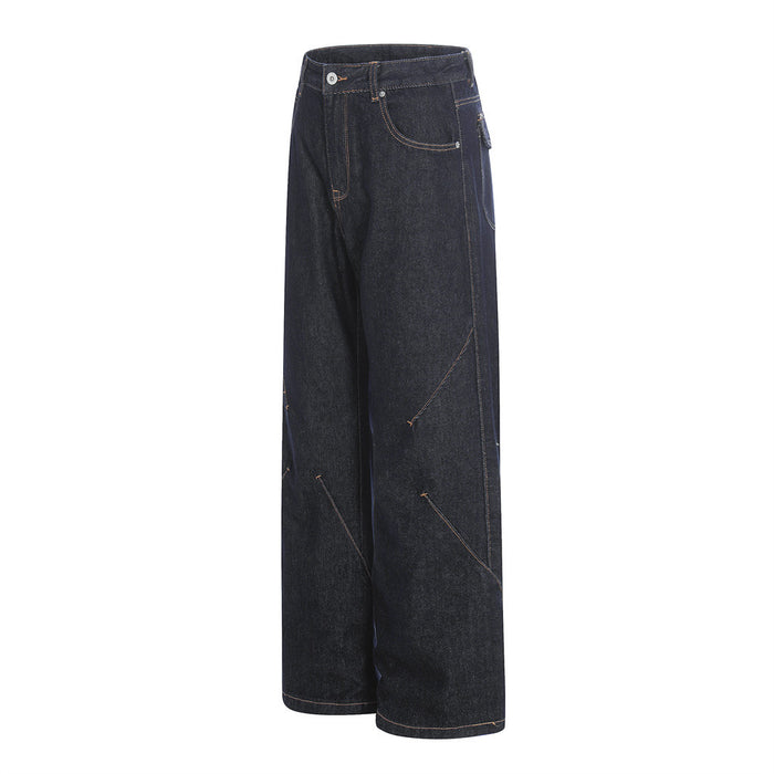 Side view of dark wide-leg raw denim jeans with diagonal seam details and front pocket
