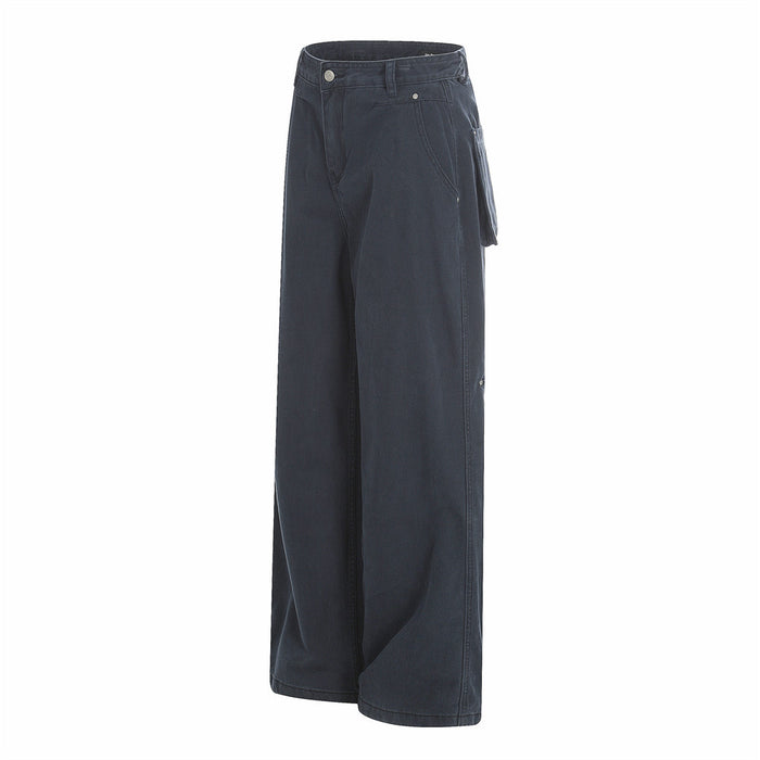 Navy utility trousers in side view with wide legs and hanging pocket detail