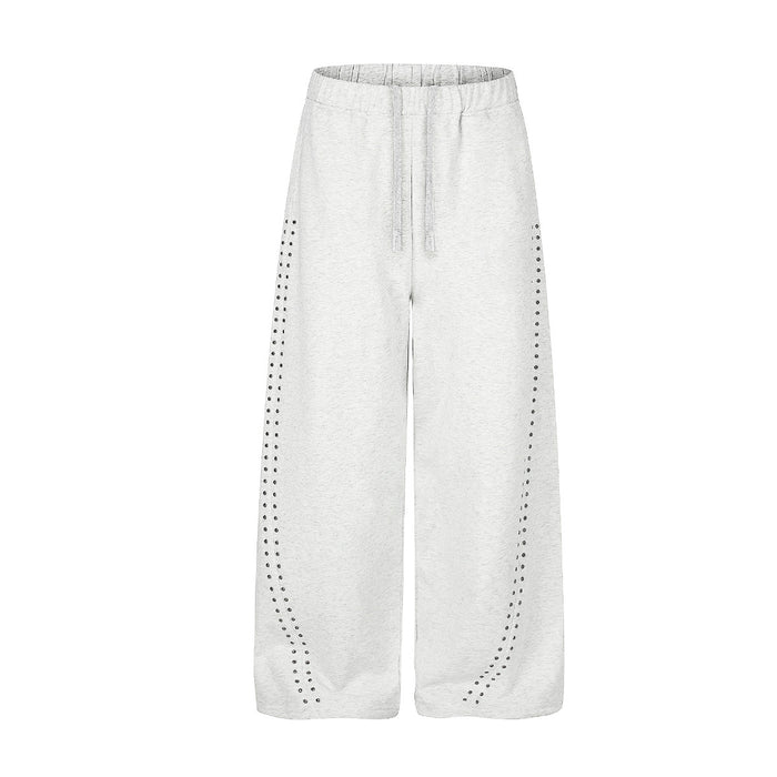 Wide leg studded sweatpants in heather gray with curved rhinestone stud detailing on front legs and elastic drawstring waist