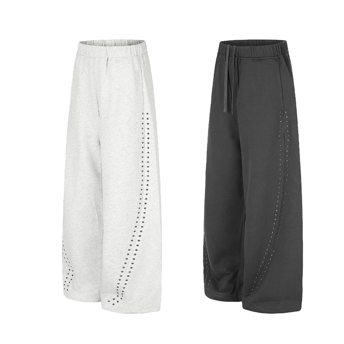 Light gray and black wide-leg sweatpants displayed together with elastic waists and studded side detailing