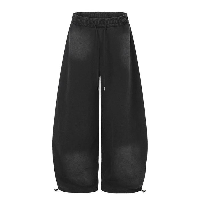 Black wide-leg sweatpants front view with elastic waist and drawstring