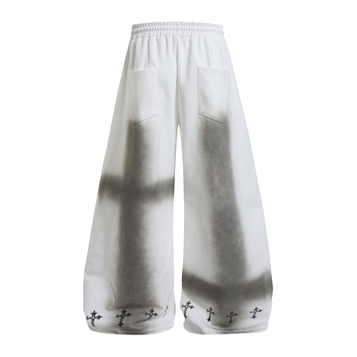 Back view of white wide-leg sweatpants with gray washed shading, rear pockets, and cross-print hems