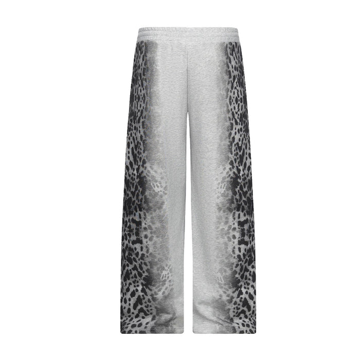 Front view of heather gray wide-leg sweatpants with black leopard-print panels along both outer legs