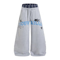 Trouvaille wide-leg sweatpants in heather gray with navy plaid waistband and blue collegiate star graphic print