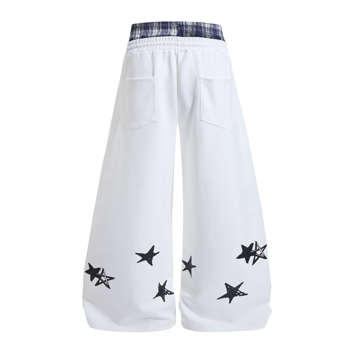 White wide-leg sweatpants shown from the back with plaid waistband, two rear pockets, and black star graphics