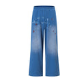 Wide-leg washed blue sweatpants with stencil letter graphic and red star print, elastic waistband, straight leg silhouette