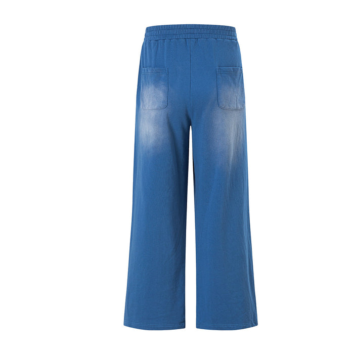 Back view of blue wide-leg pants with elastic waistband and two patch pockets
