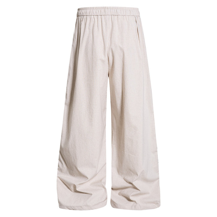 Cream wide-leg track pants back view with plain legs and an elastic waistband