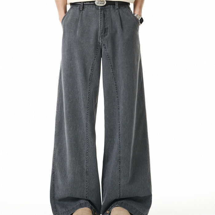 Cement grey wide-leg washed denim jeans with pleated waistband and metal button hem detail, front and back view