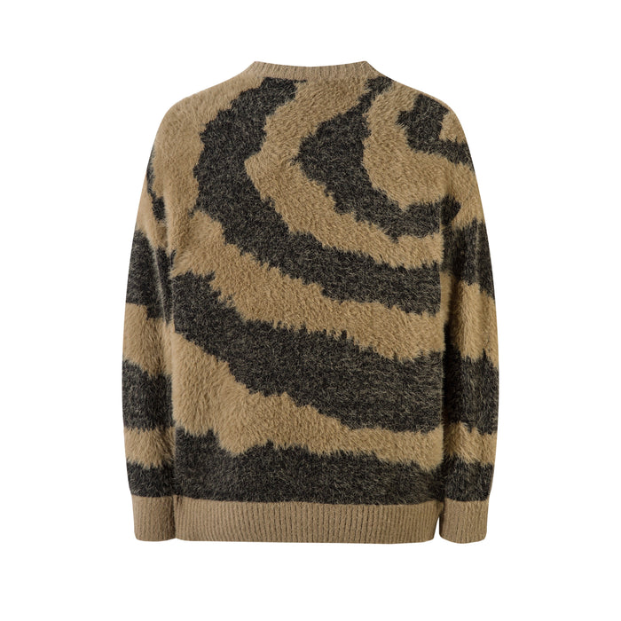 Back view of tan and black zebra print fluffy knit sweater with ribbed crew neck and hem