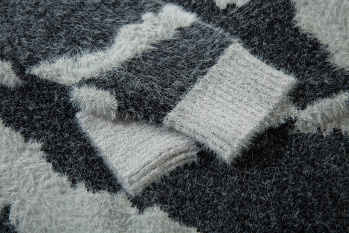 Close-up of black and white zebra print fluffy knit texture on the sweater
