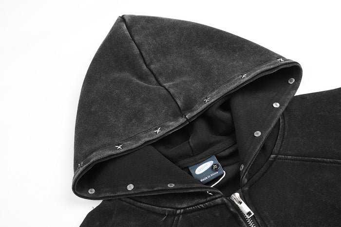 Close-up of the washed charcoal hood showing snap fasteners, stitched seams, and the inner label