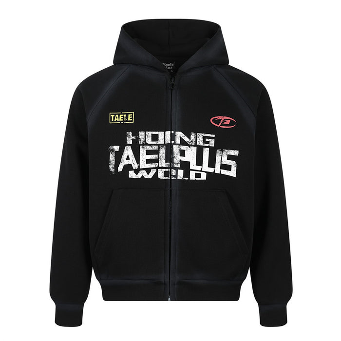 Black zip-up hoodie with distressed TAELPLUS graphic print on chest, raglan sleeves, and structured hood — front view