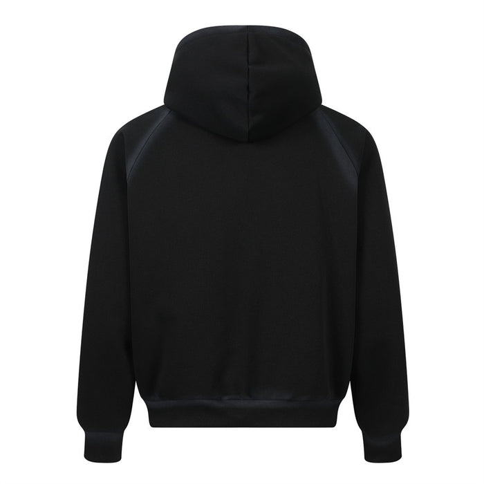 Black zip-up hoodie shown from the back with raglan sleeves and ribbed hem