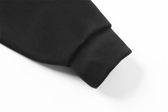 Black hoodie ribbed cuff close-up on the sleeve